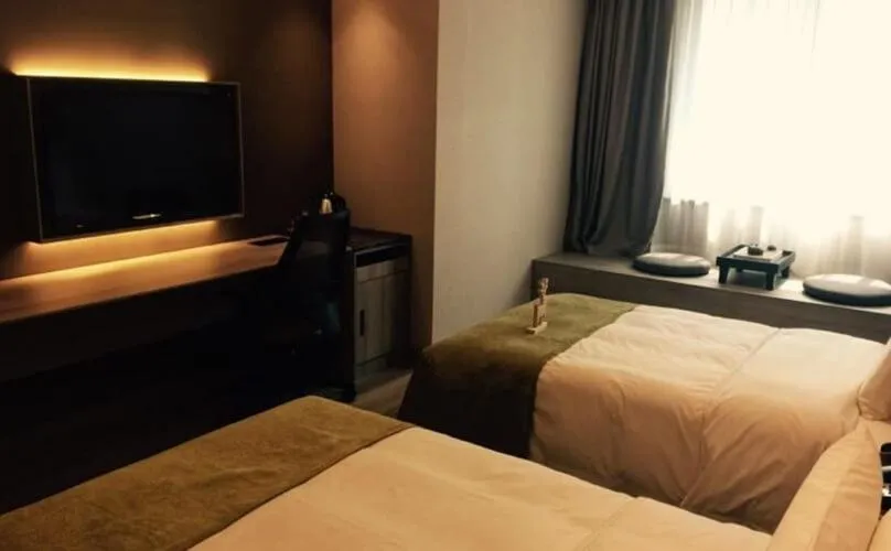 Bed in Atour Hotel Dalian Zhongshan Square