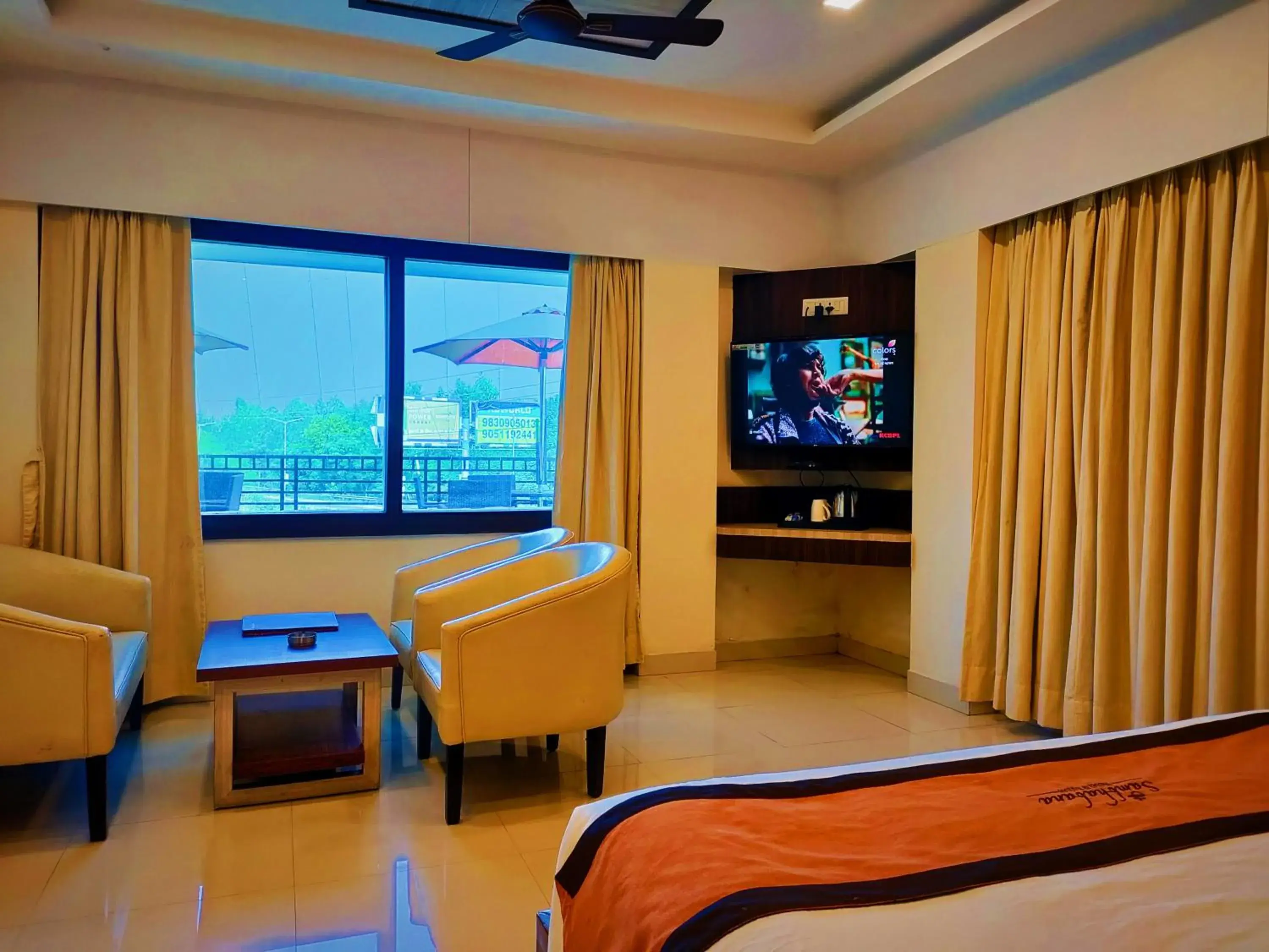 Seating area, Bed in Sambhabana Hotel & Suites Seating area, Bed in Sambhabana Hotel & Suites