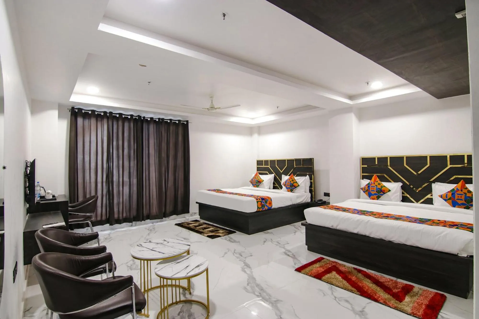 Bed in FabHotel Sky Suites Karkardooma