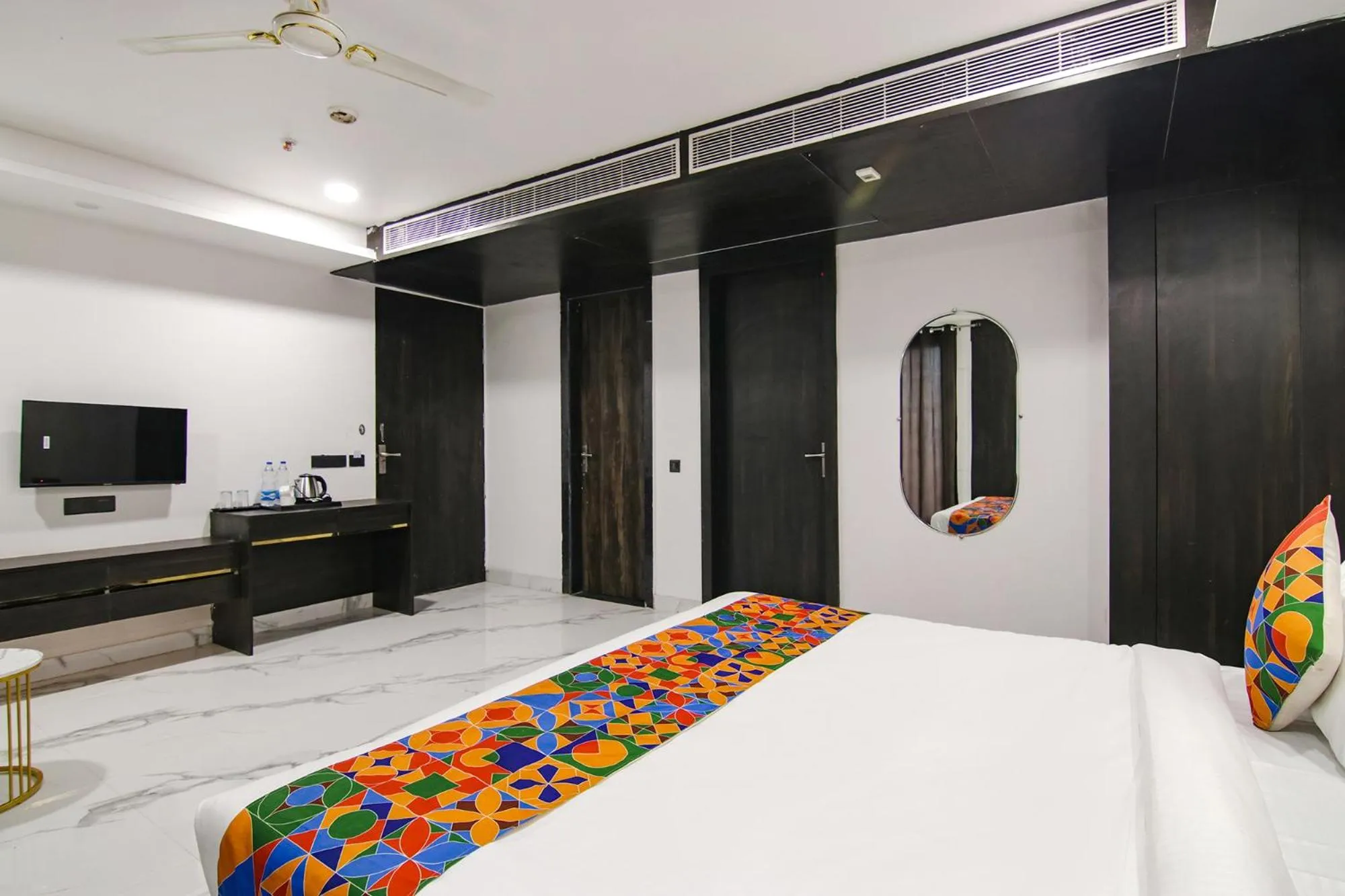 Bed in FabHotel Sky Suites Karkardooma