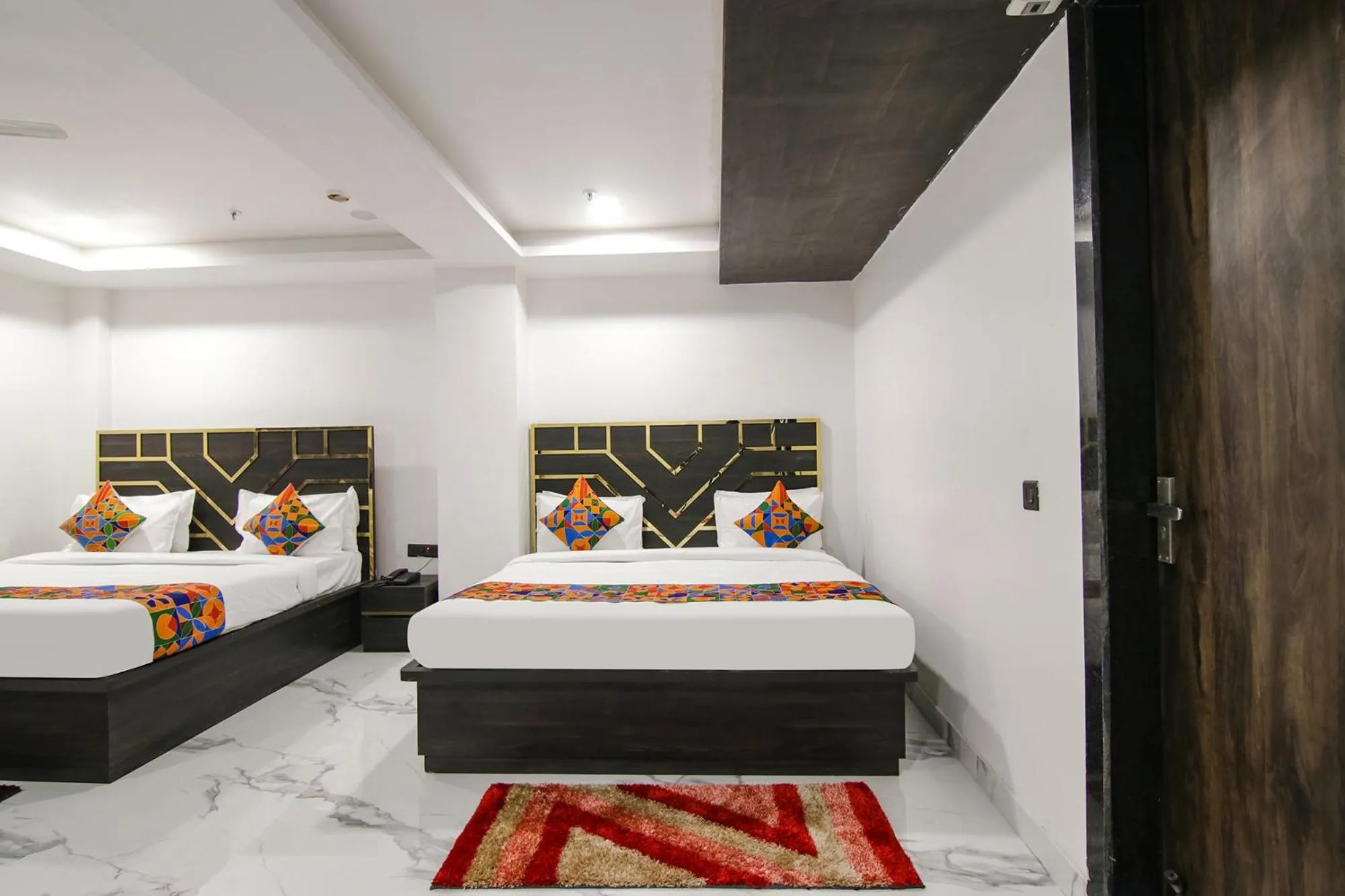 Bed in FabHotel Sky Suites Karkardooma