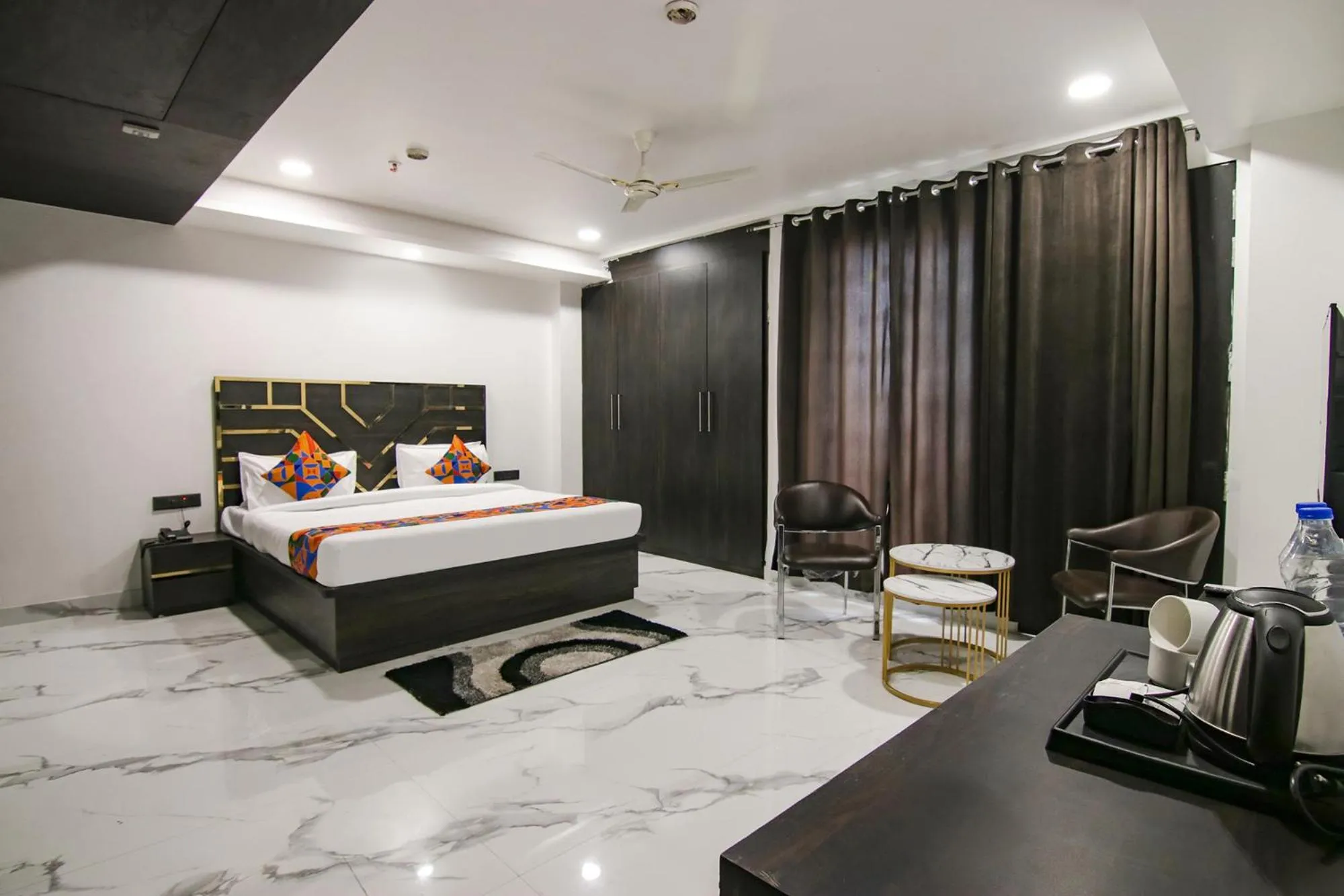 Bed in FabHotel Sky Suites Karkardooma