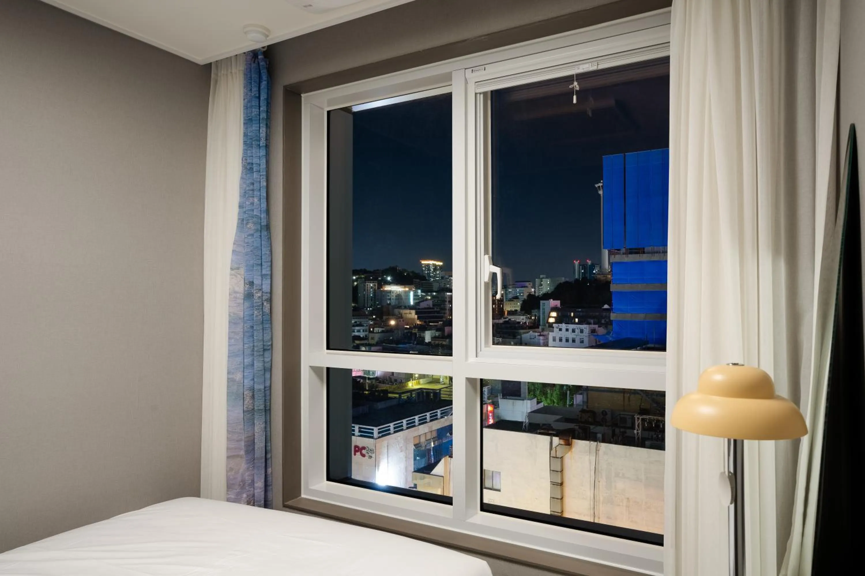 Bed in Radiant Nampo Hotel