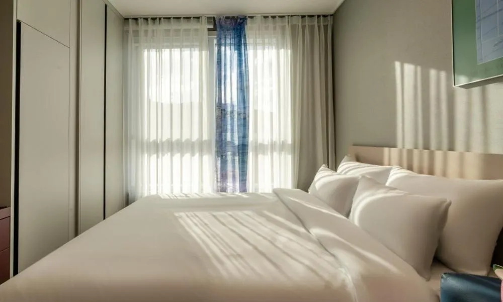 Bed in Radiant Nampo Hotel