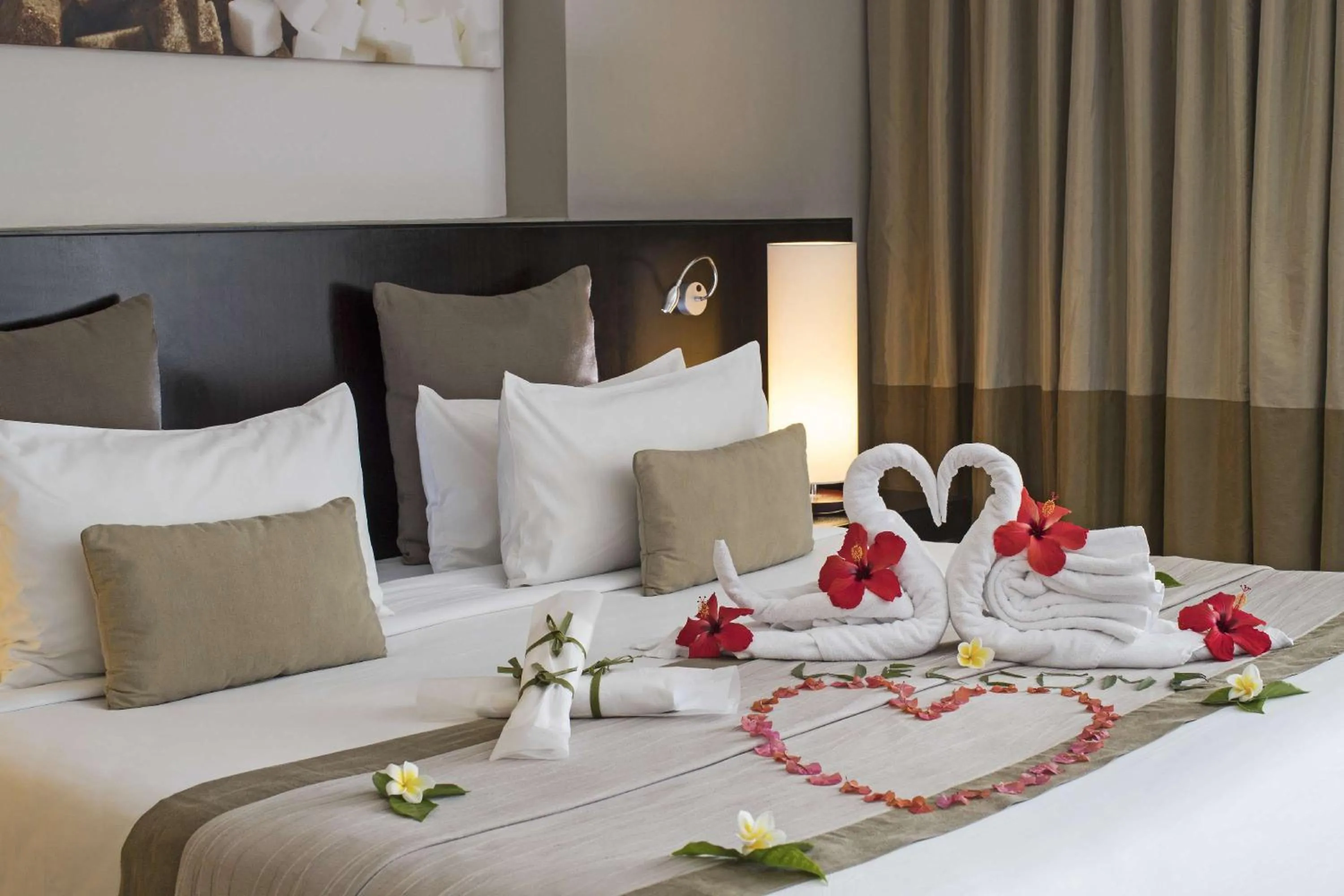 Bed in Crystals Beach Resort Belle Mare, a member of Radisson Individuals