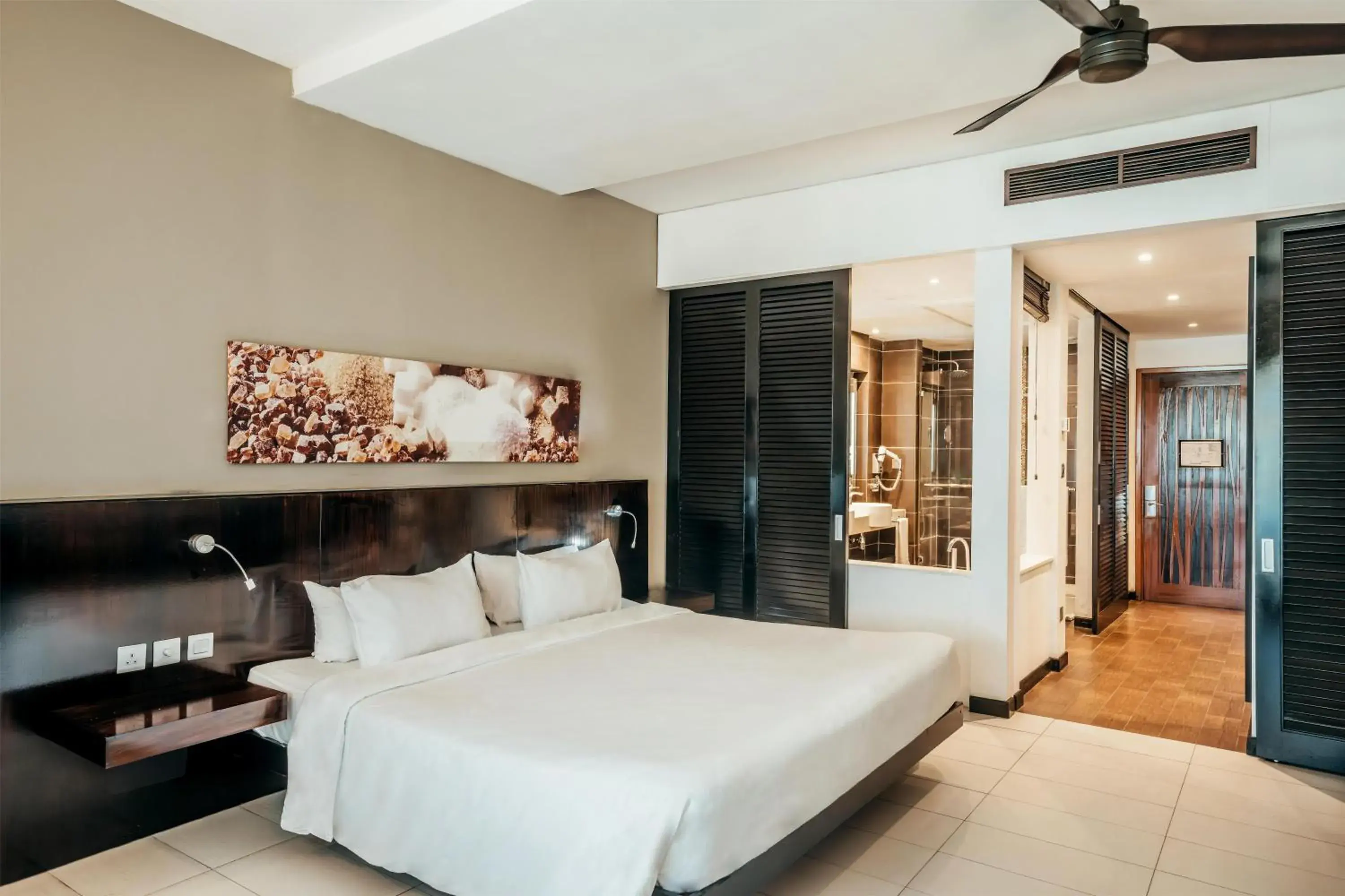 Bedroom, Bed in Crystals Beach Resort Belle Mare, a member of Radisson Individuals Bedroom, Bed in Crystals Beach Resort Belle Mare, a member of Radisson Individuals