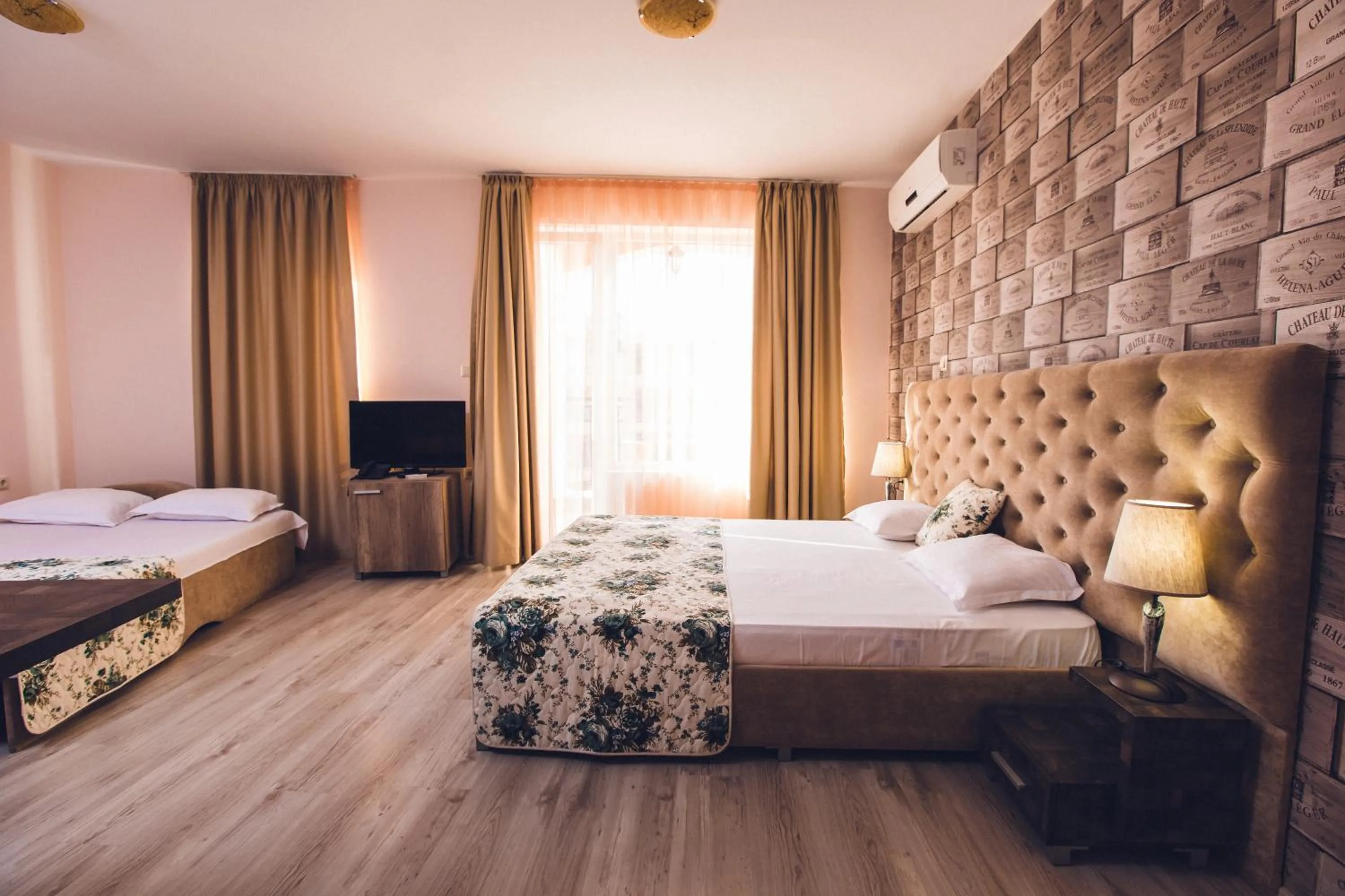 Bed in Avenue Deluxe Hotel