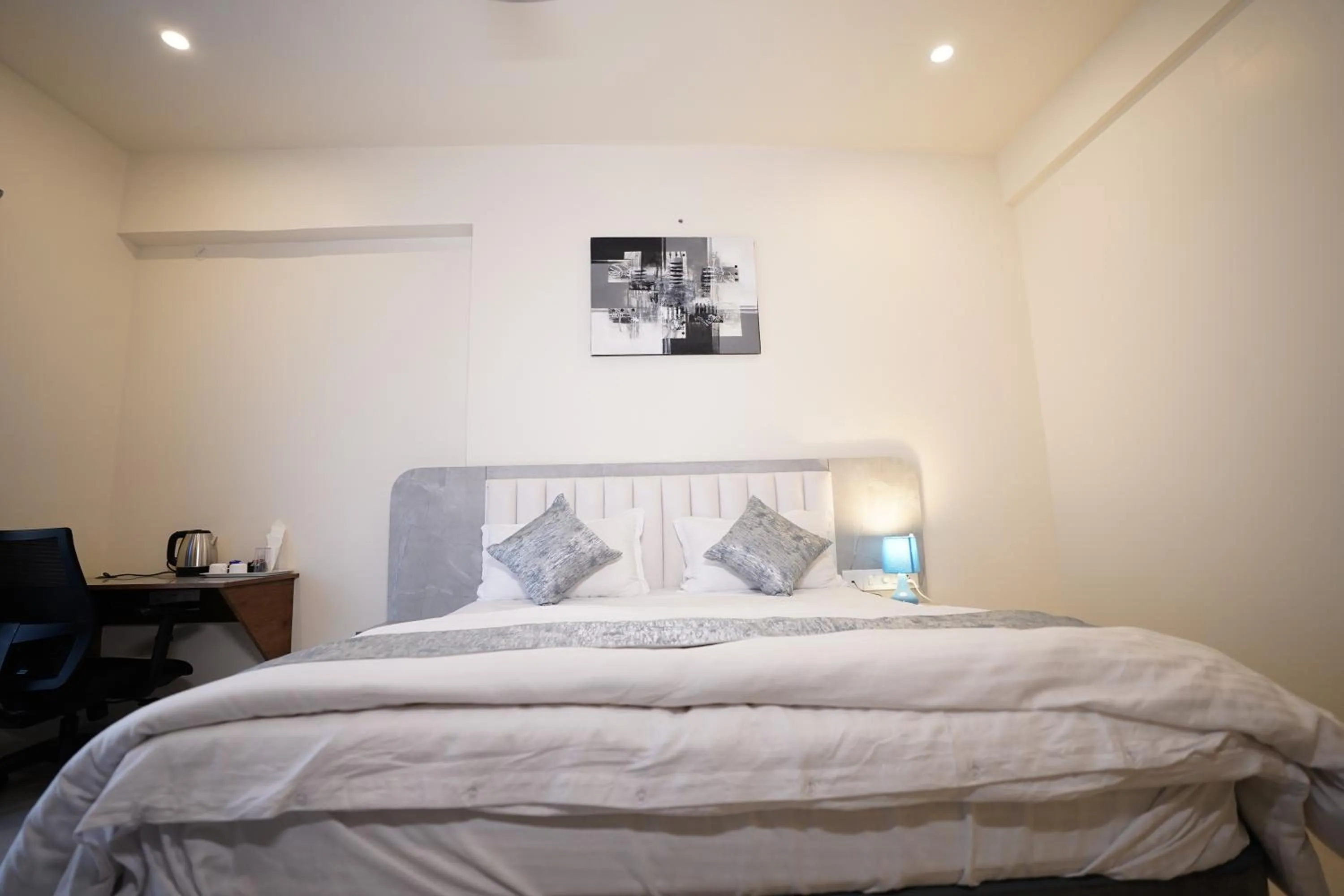 Bed in DrizzleDrop Inn Chennai