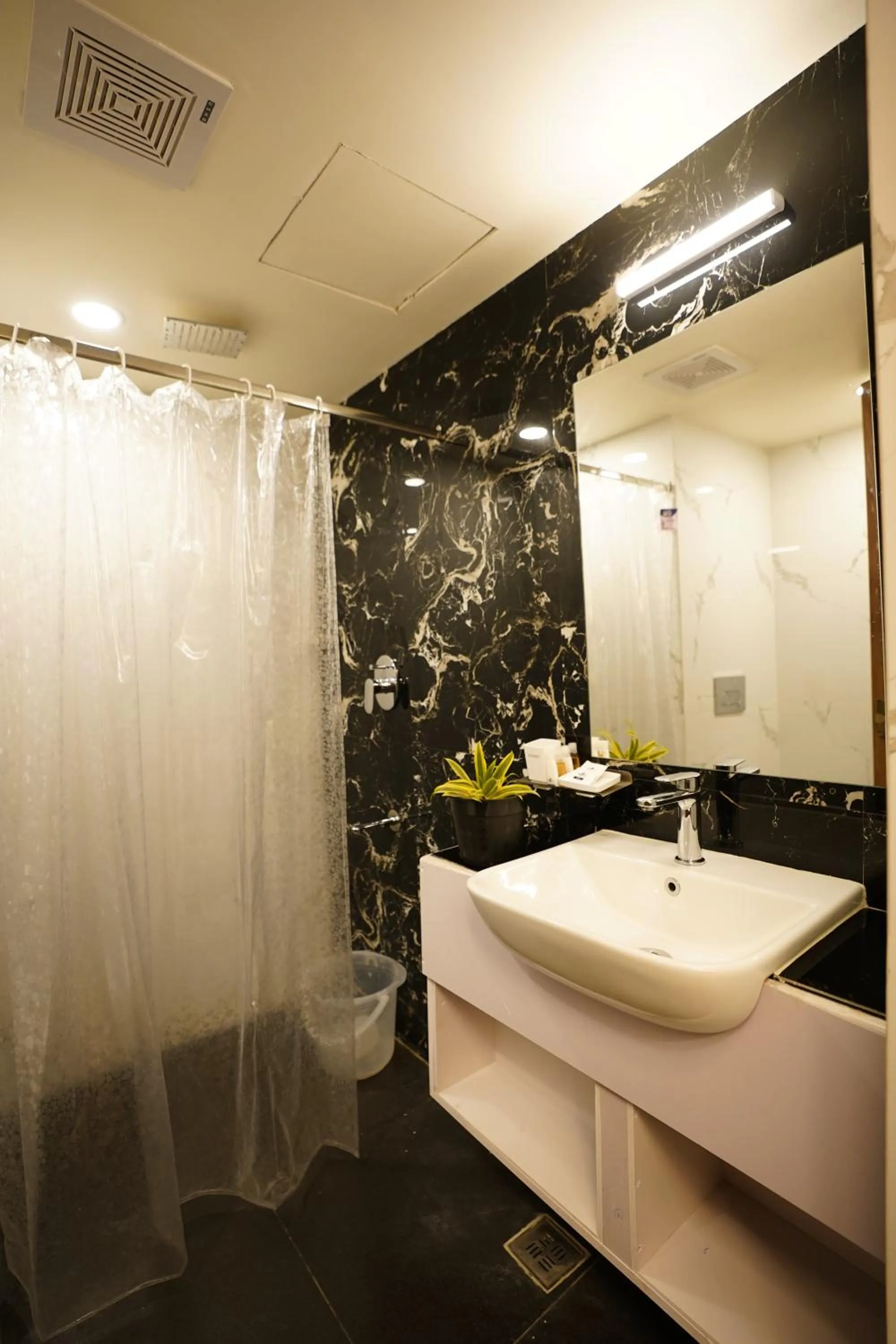 Shower in DrizzleDrop Inn Chennai