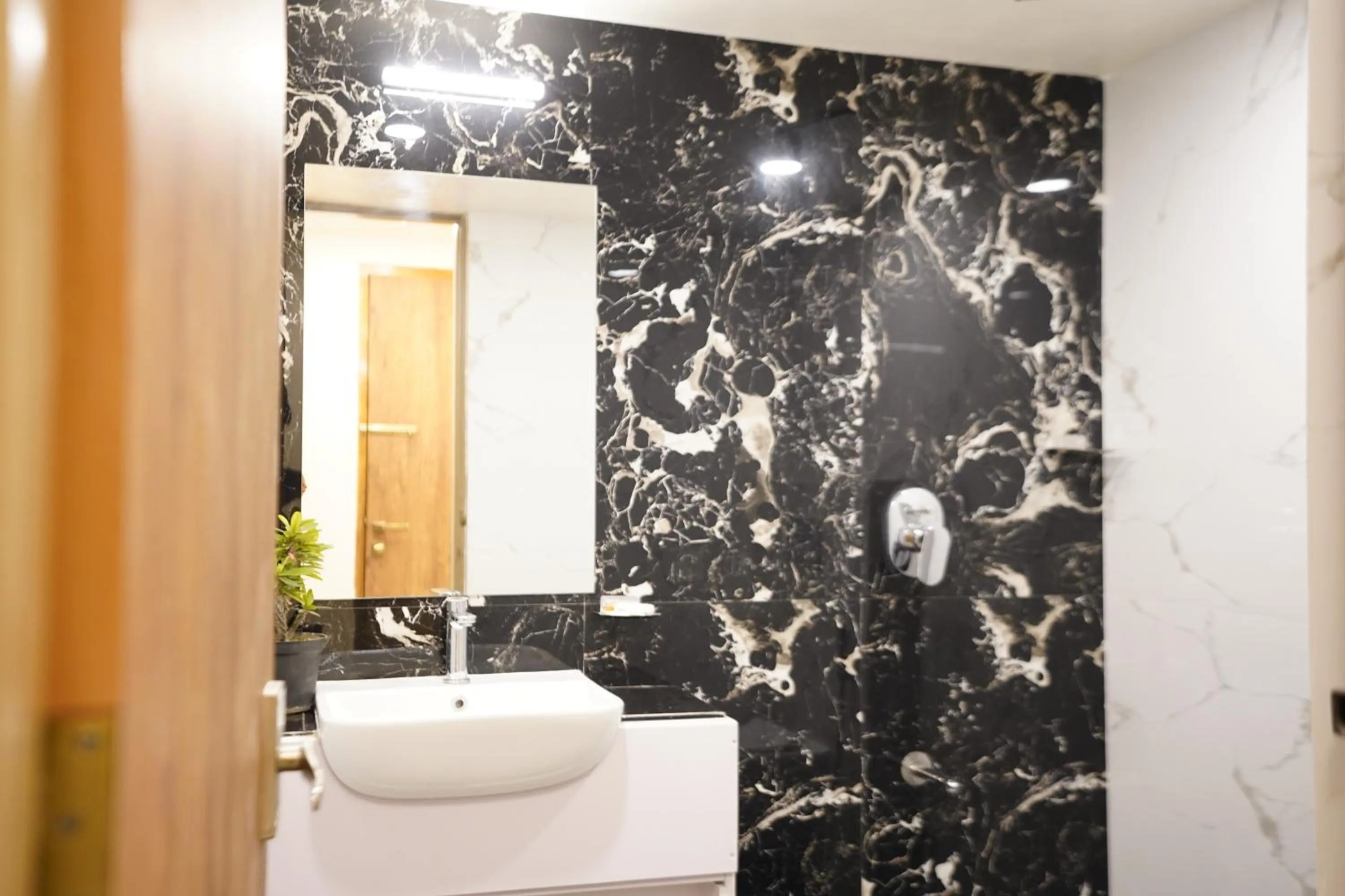 Shower in DrizzleDrop Inn Chennai