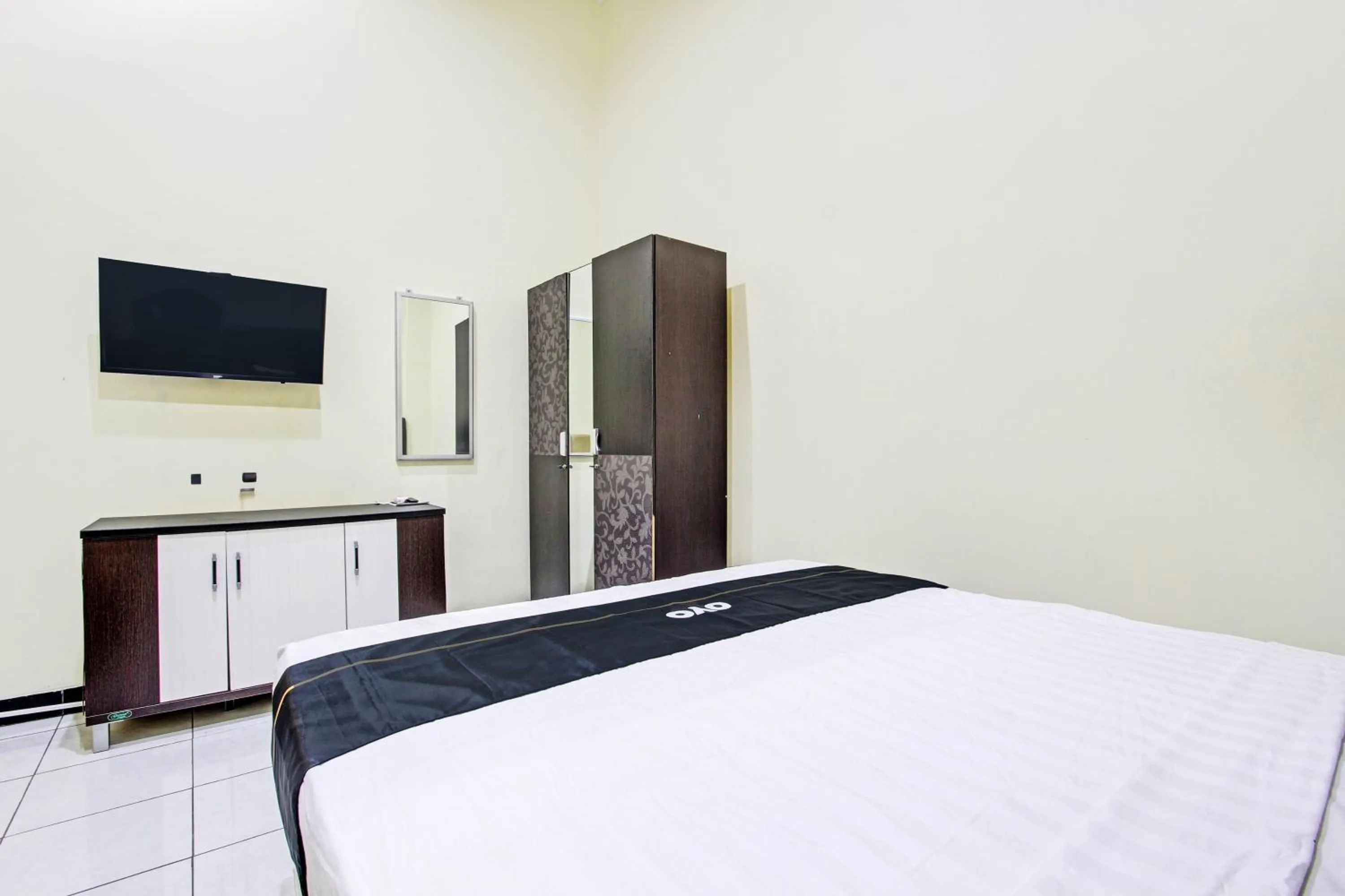 Bedroom in Super OYO Capital O 93204 Hotel Mulia Dua Syariah