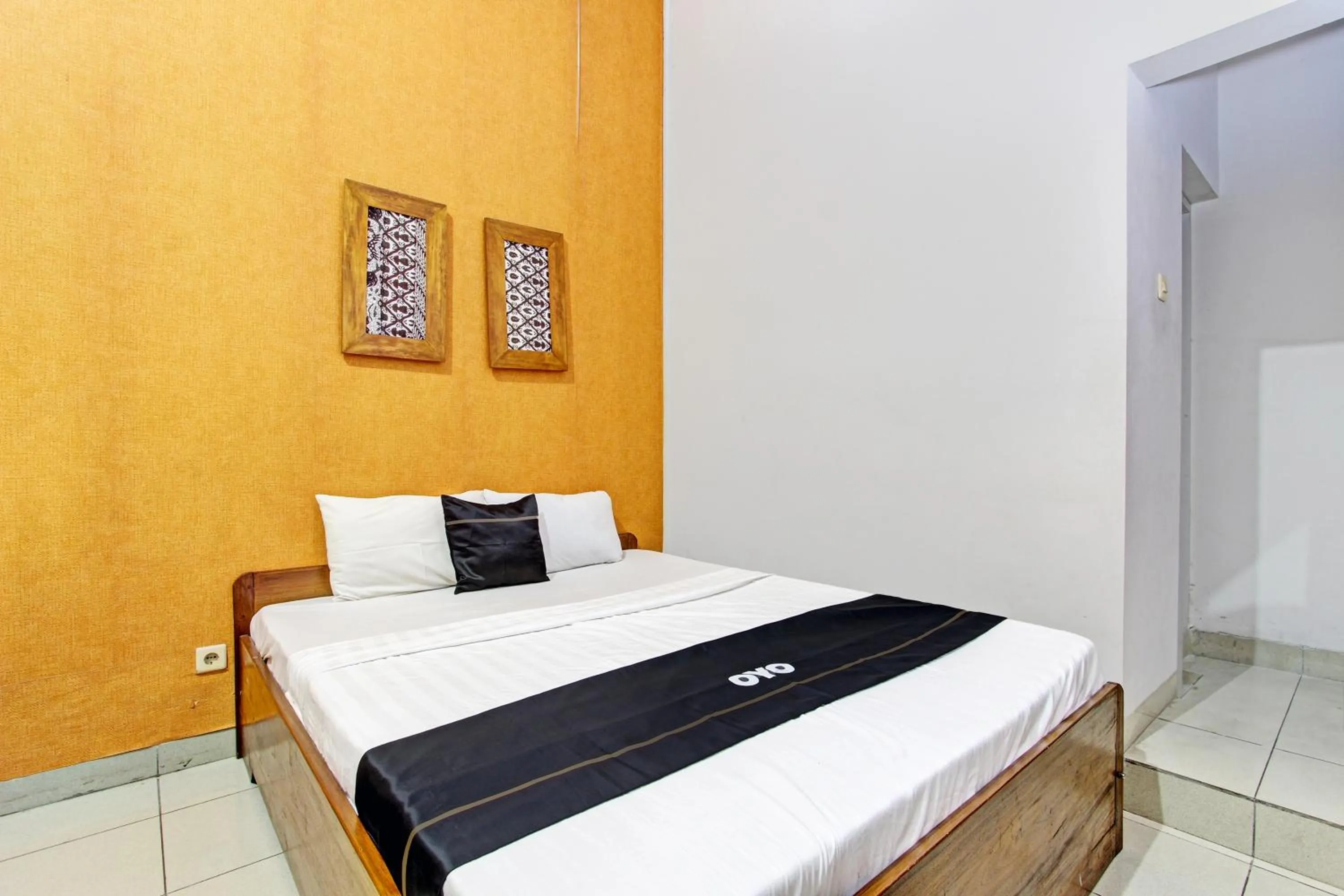 Bedroom in Super OYO Capital O 93240 Candra Dewi Hotel