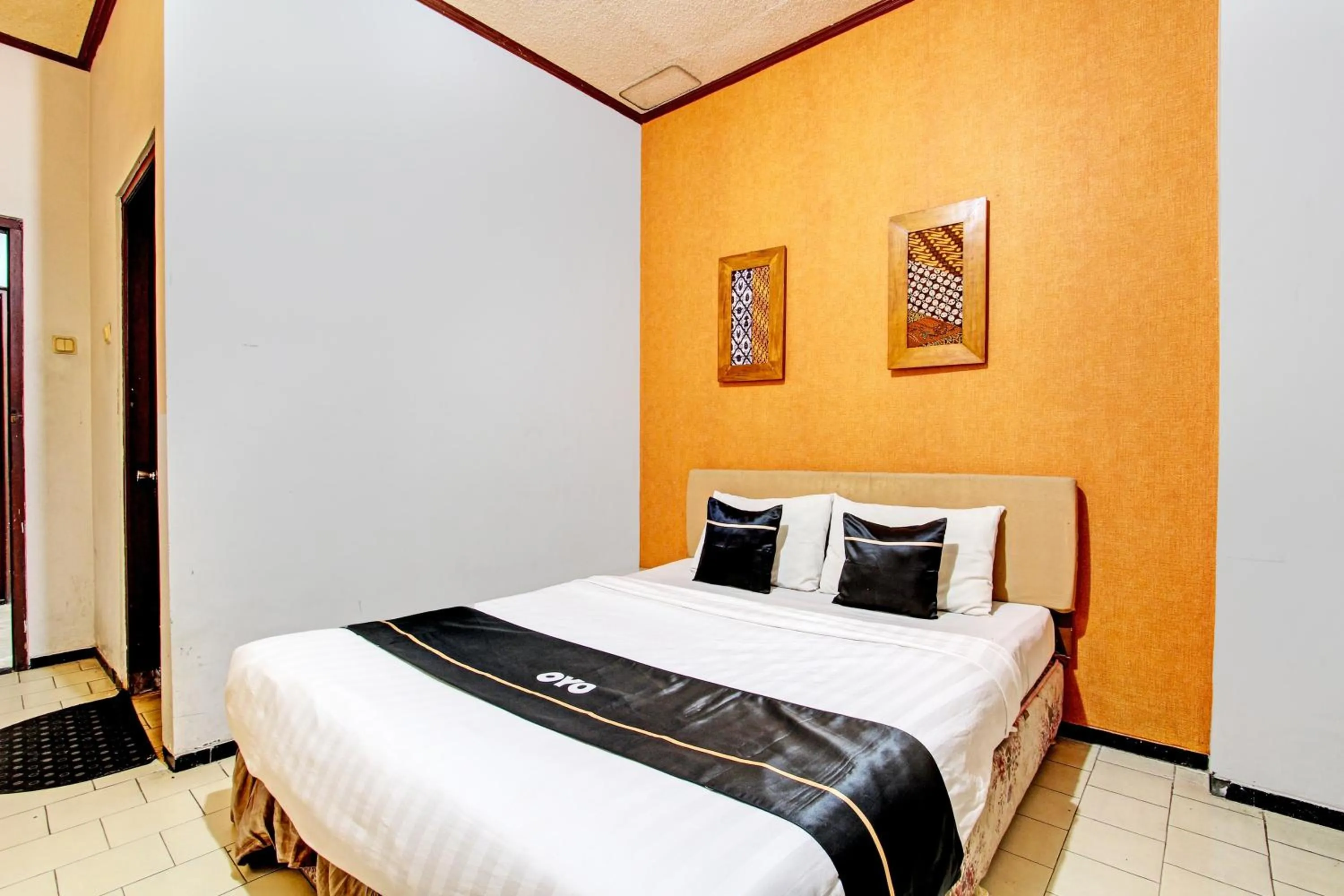 Bedroom in Super OYO Capital O 93240 Candra Dewi Hotel