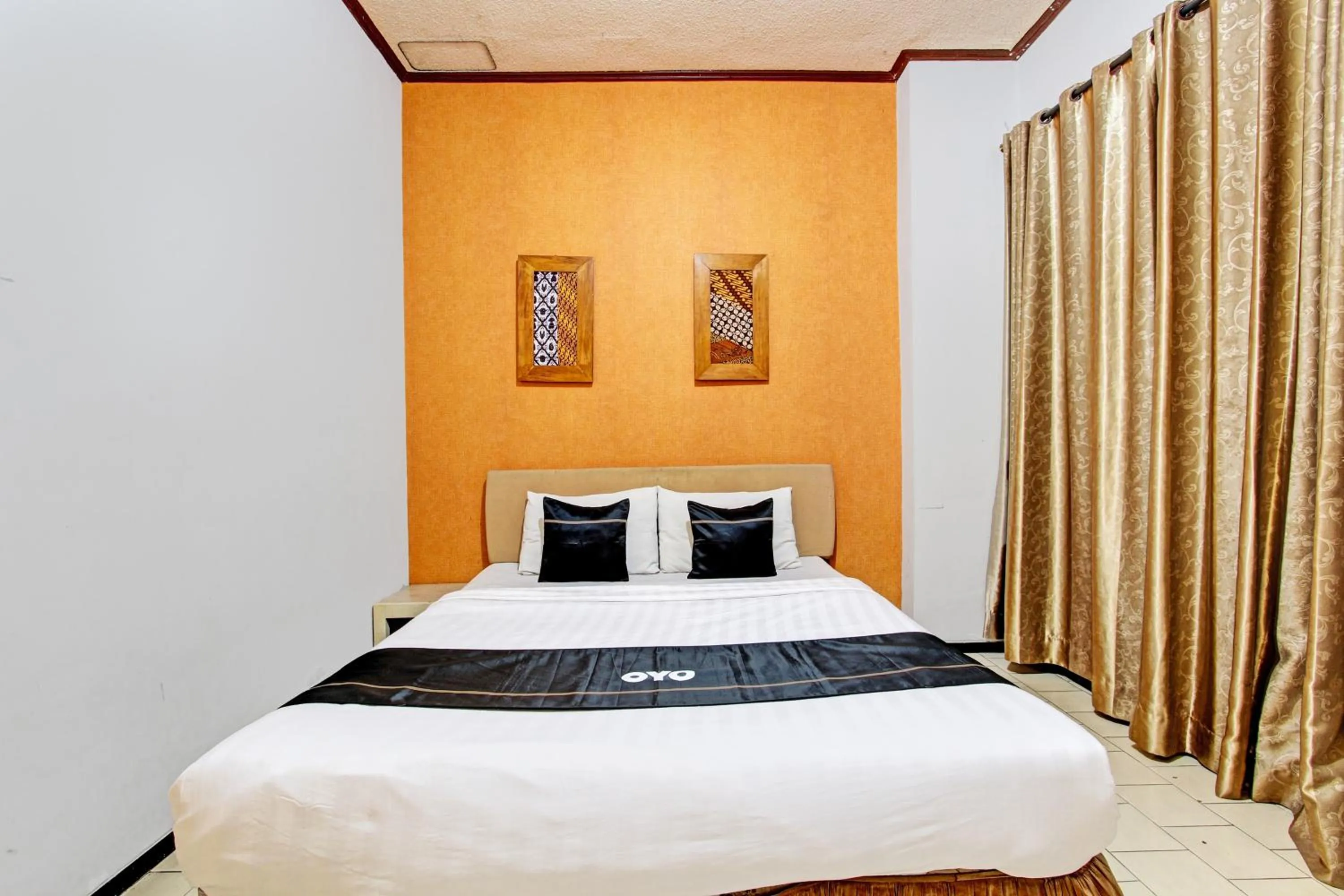 Bedroom in Super OYO Capital O 93240 Candra Dewi Hotel