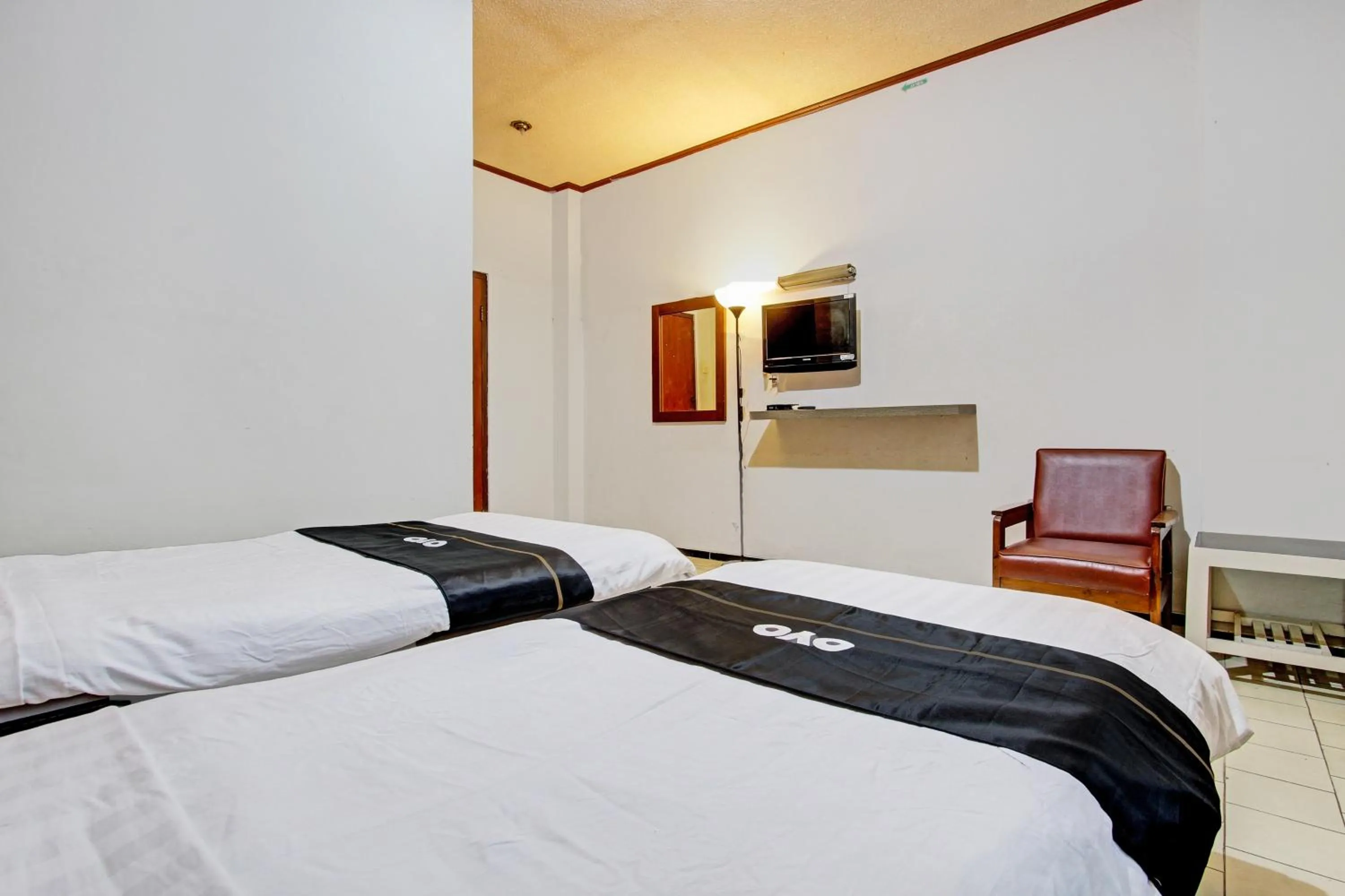 Bedroom in Super OYO Capital O 93240 Candra Dewi Hotel