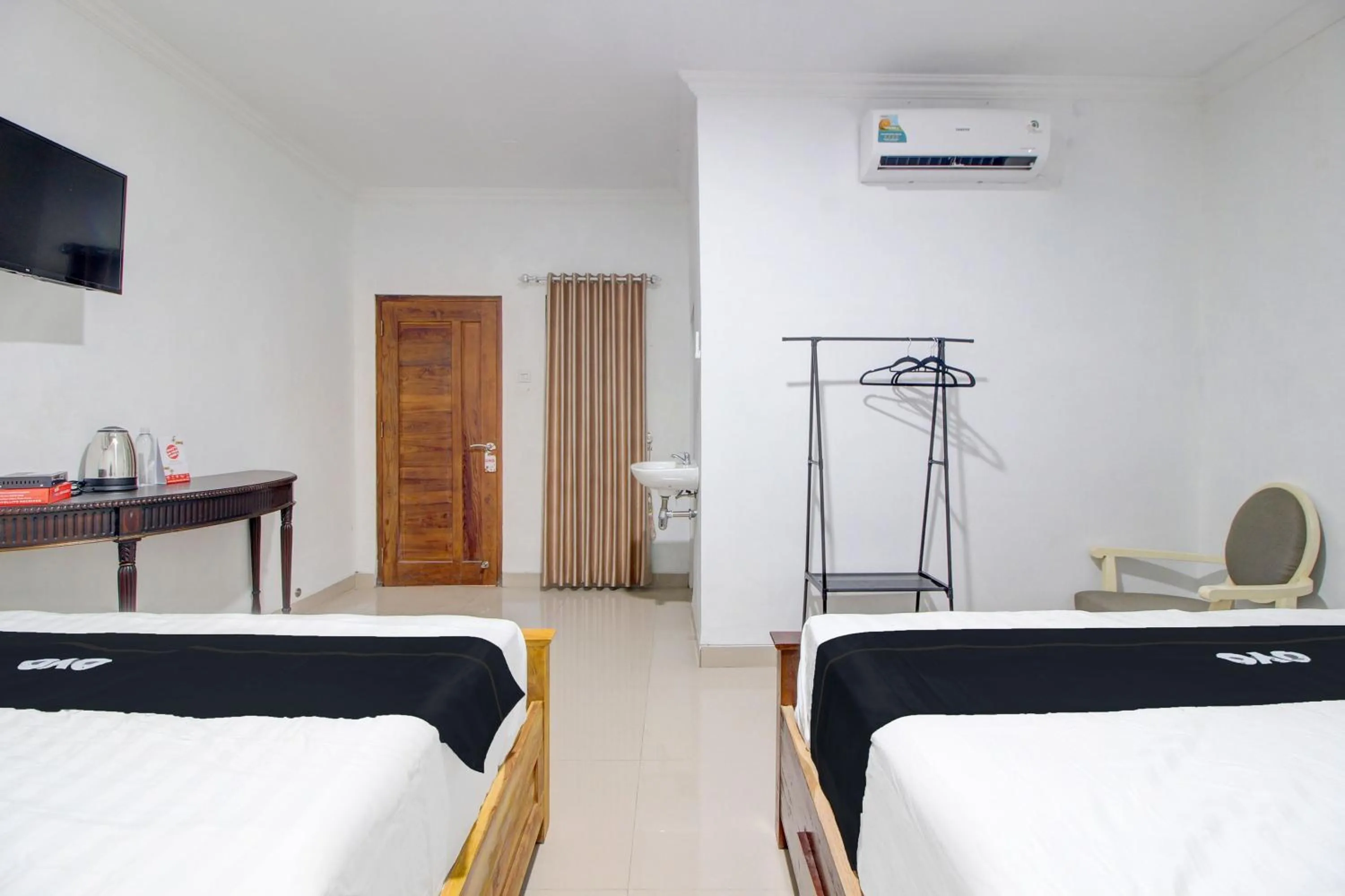 Bedroom in Capital O 93266 Palmier Hotel