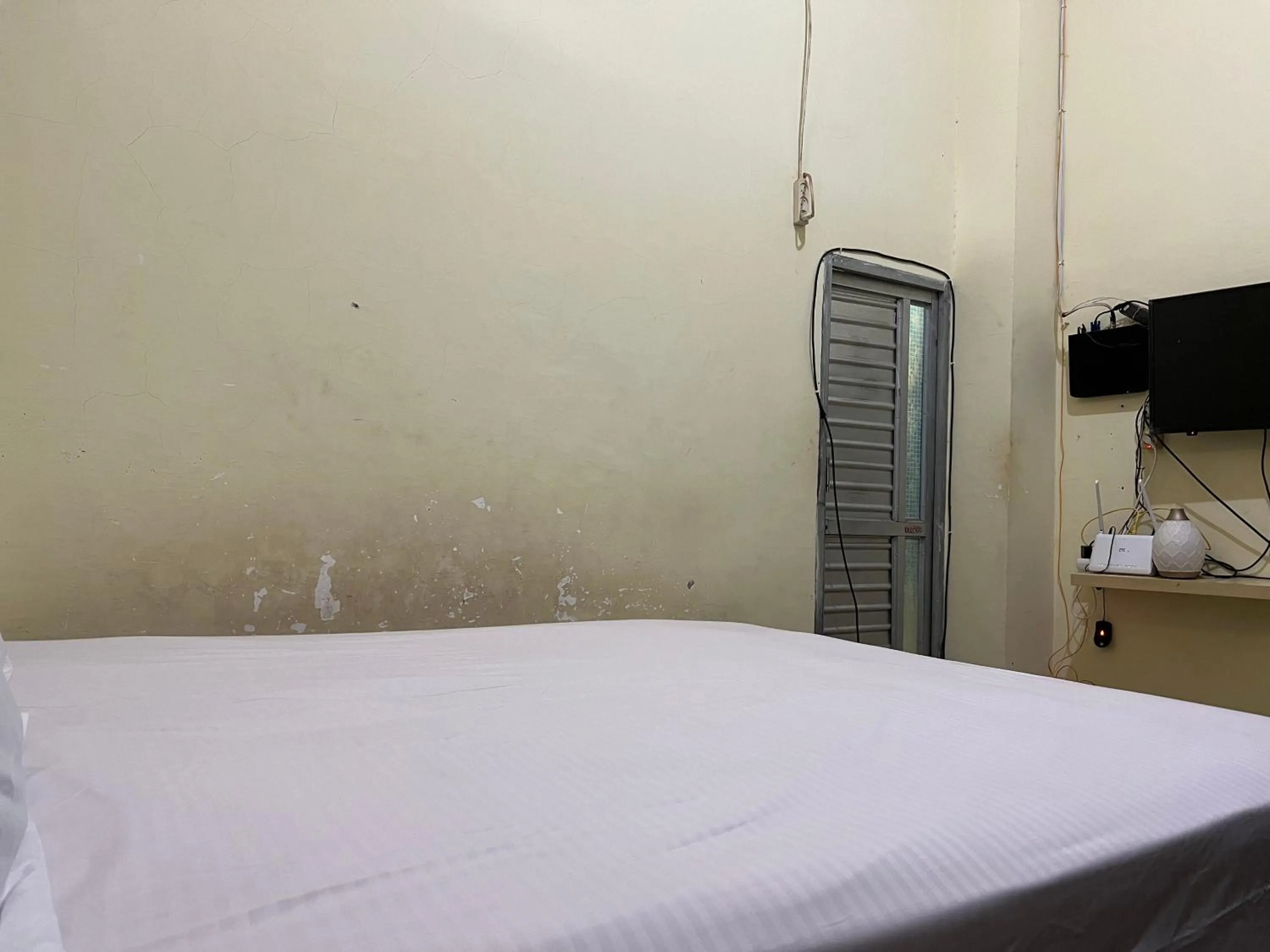 Bedroom, Bed in Hotel O Mely Homestay