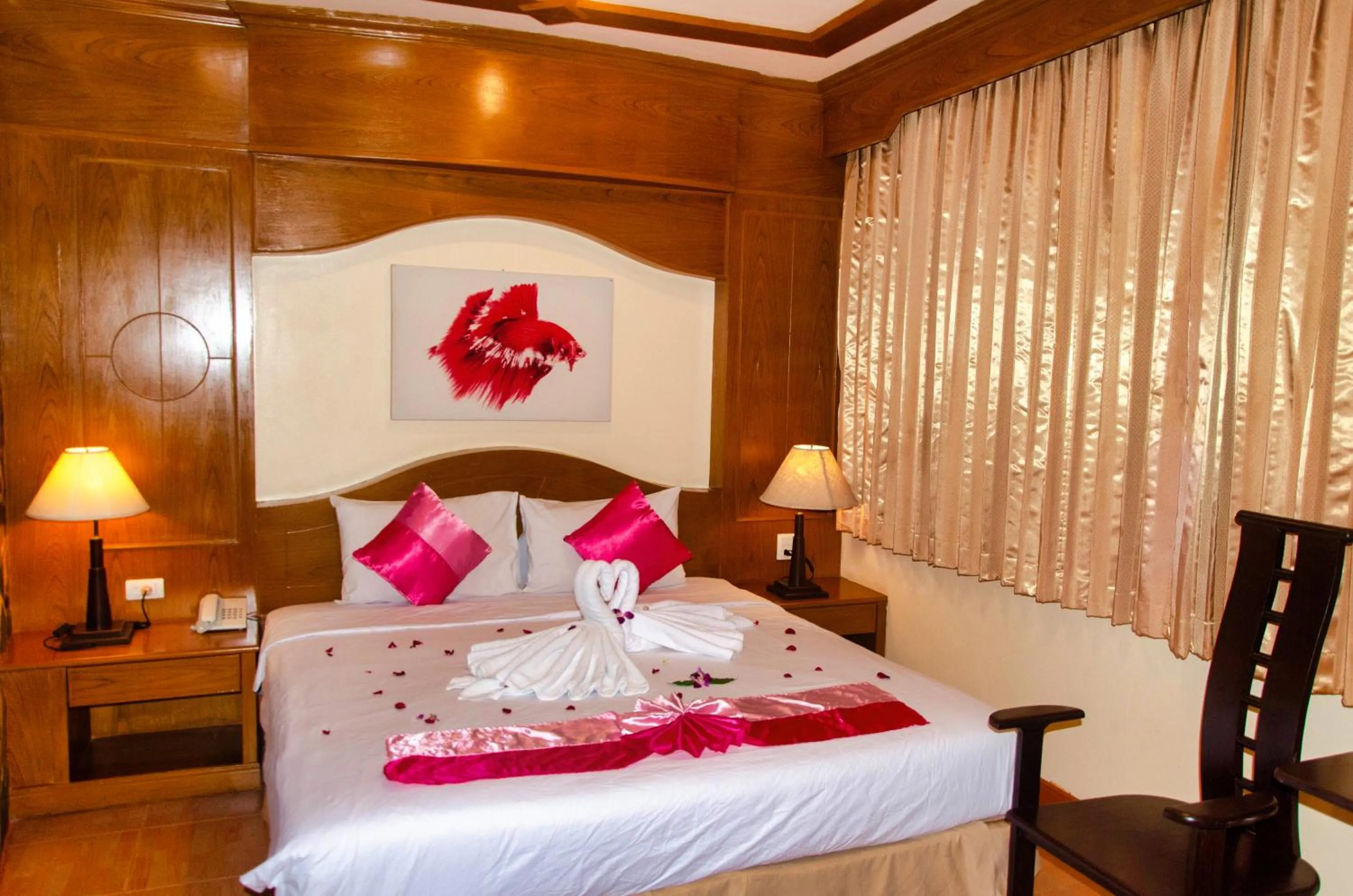 Bed in Diva Patong Hotel