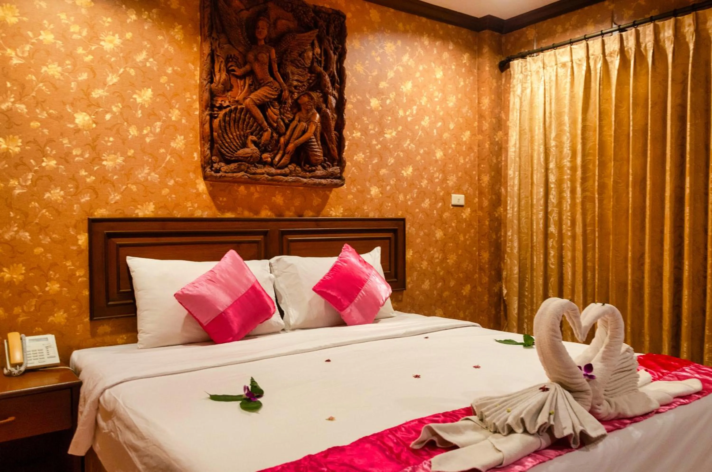 Bed in Diva Patong Hotel