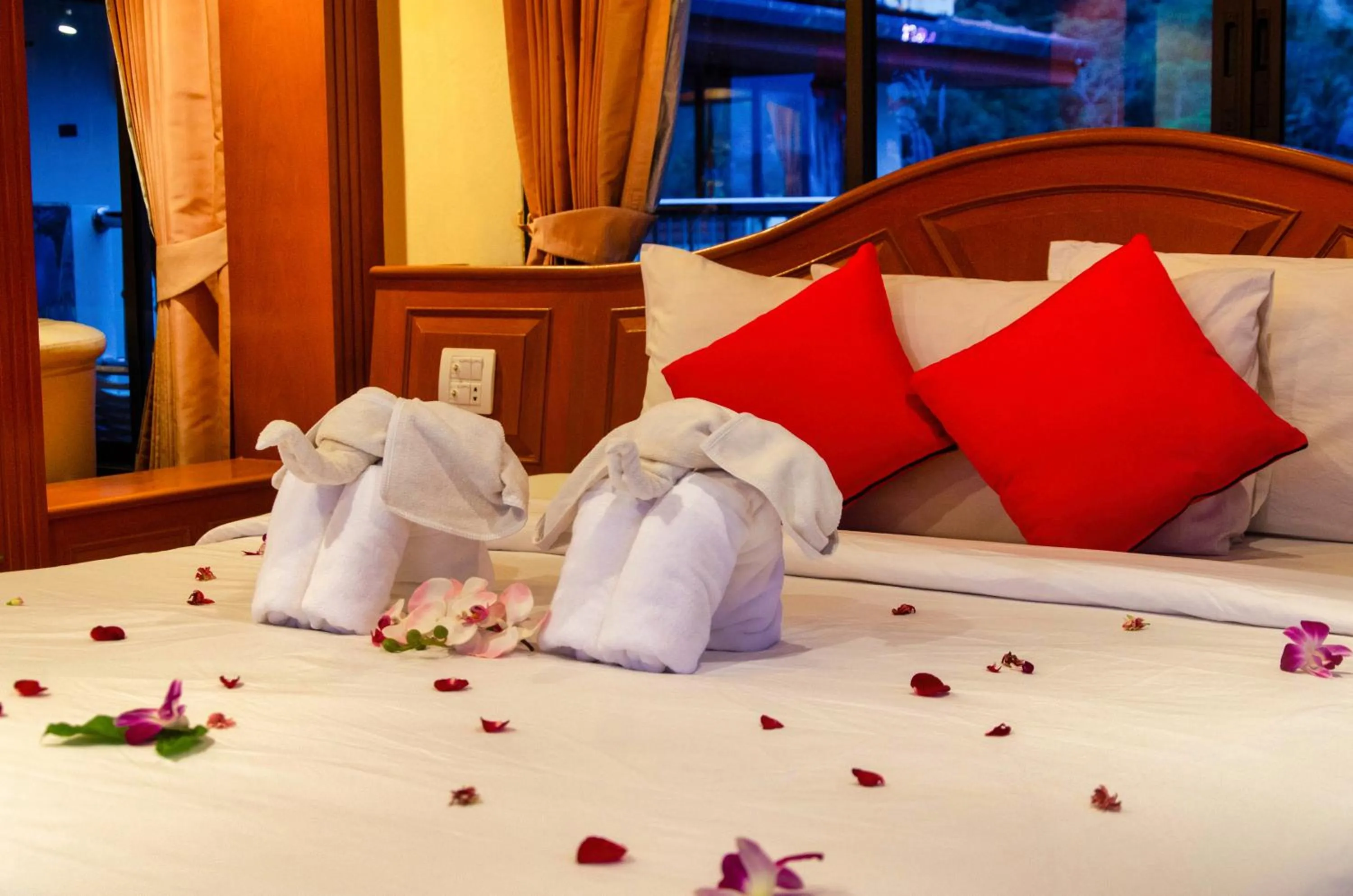 Bed in Diva Patong Hotel