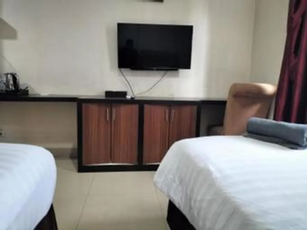 Bed in Rizen Premiere Hotel