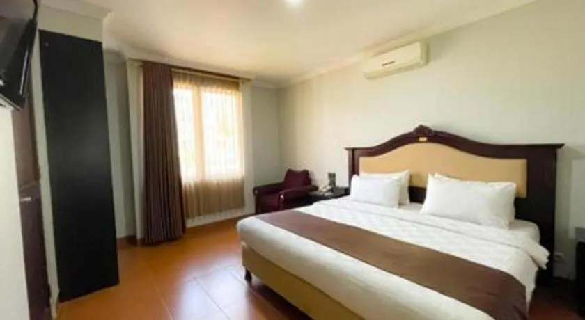 Bed in Rizen Premiere Hotel