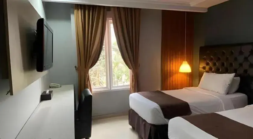 Bed in Rizen Premiere Hotel Bed in Rizen Premiere Hotel