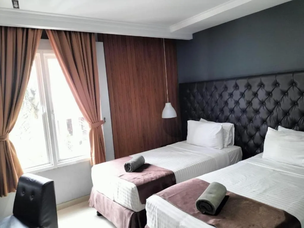 Bed in Rizen Premiere Hotel