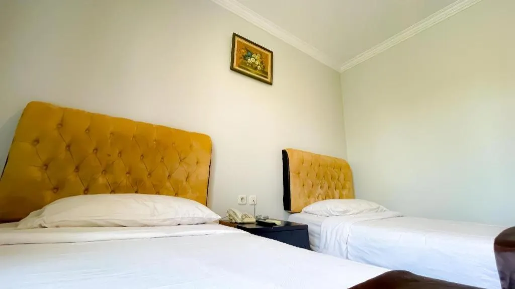 Bed in Rizen Premiere Hotel