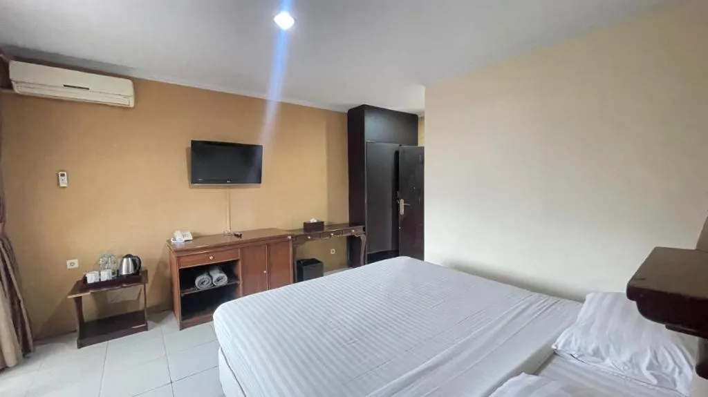 Bed in Rizen Premiere Hotel