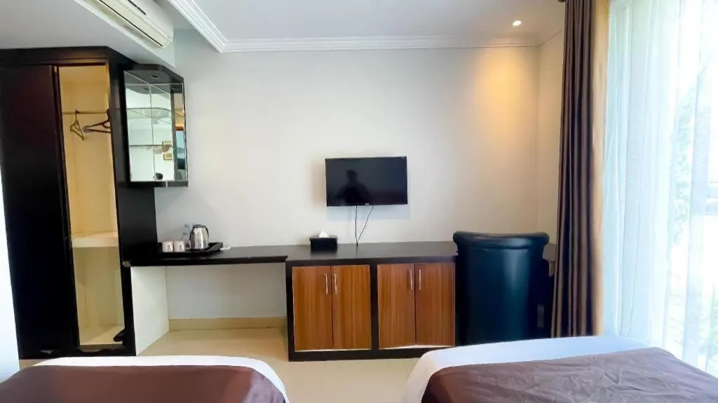 Bed in Rizen Premiere Hotel