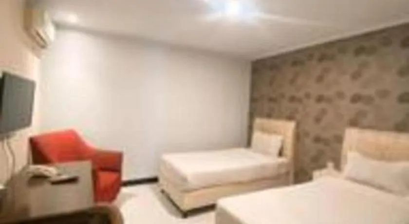 Bed in Rizen Premiere Hotel