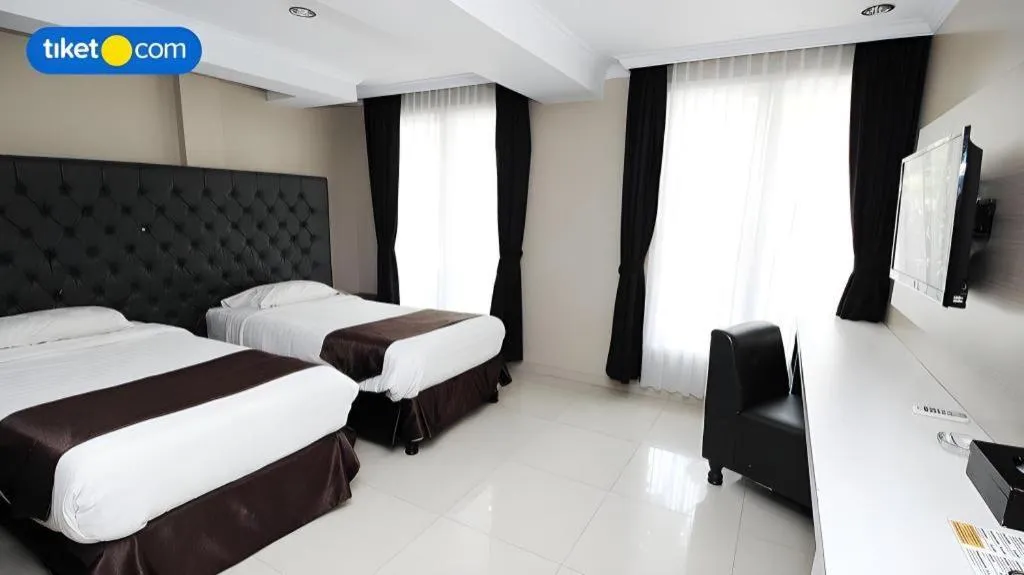 Bed in Rizen Premiere Hotel