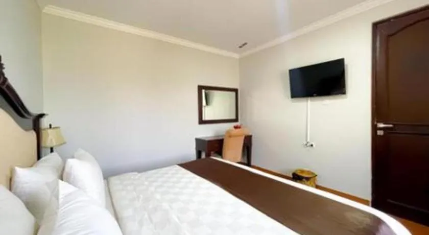 Bed in Rizen Premiere Hotel