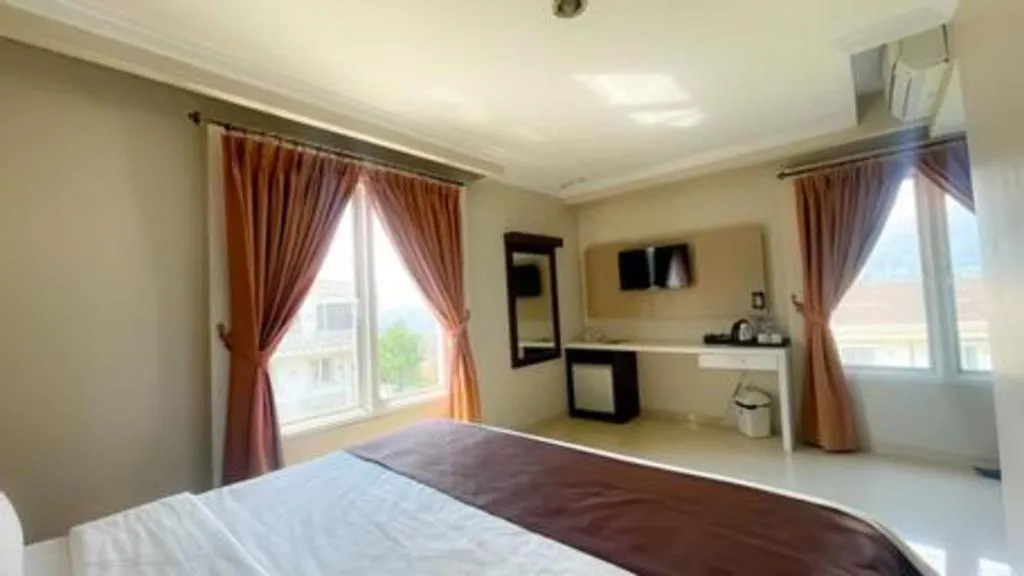 Bed in Rizen Premiere Hotel