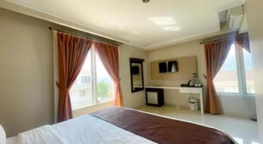 Bed in Rizen Premiere Hotel