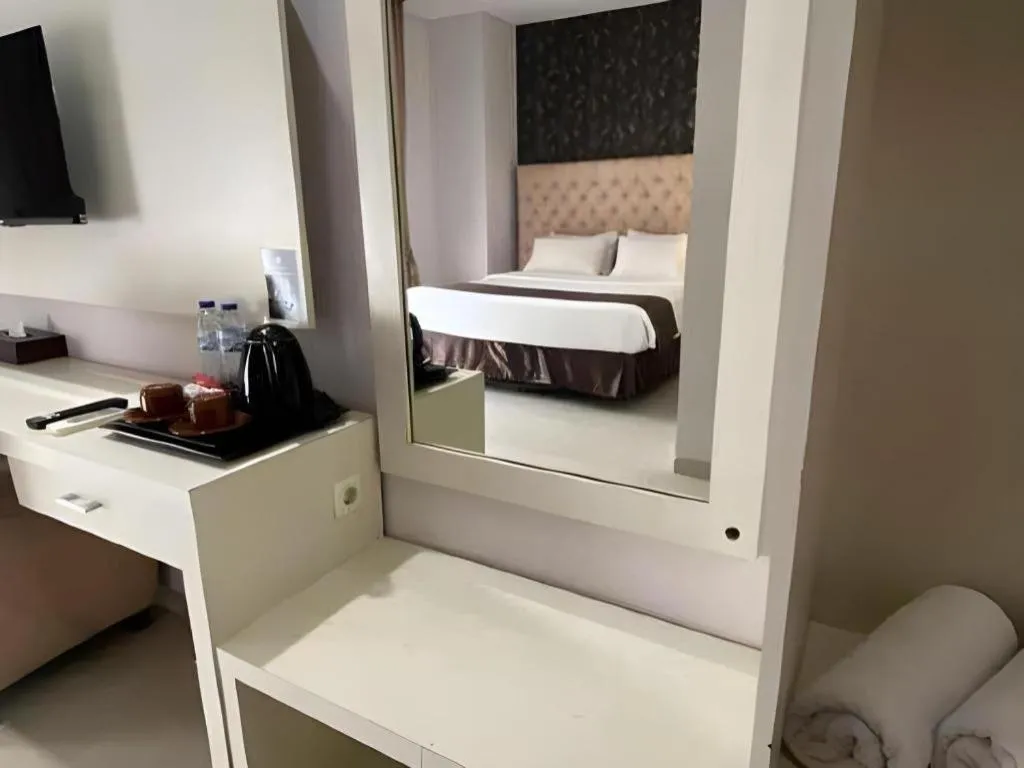 Bed in Rizen Premiere Hotel