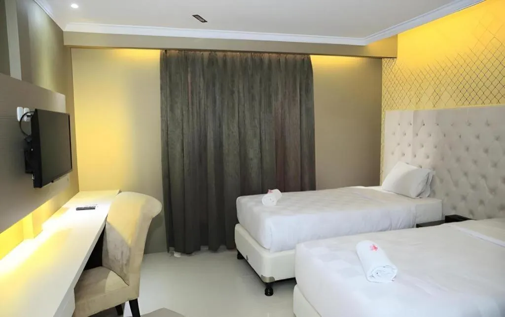 Bed in Rizen Premiere Hotel