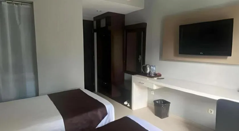 Bed in Rizen Premiere Hotel