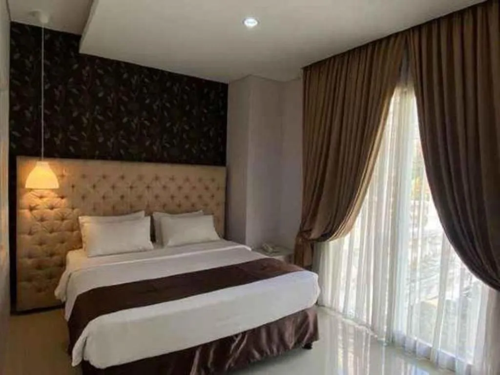 Bed in Rizen Premiere Hotel