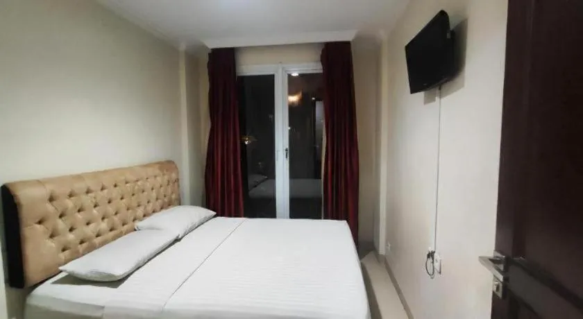 Bed in Rizen Premiere Hotel