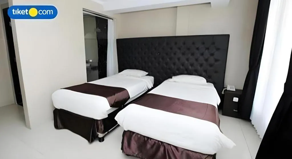 Bed in Rizen Premiere Hotel