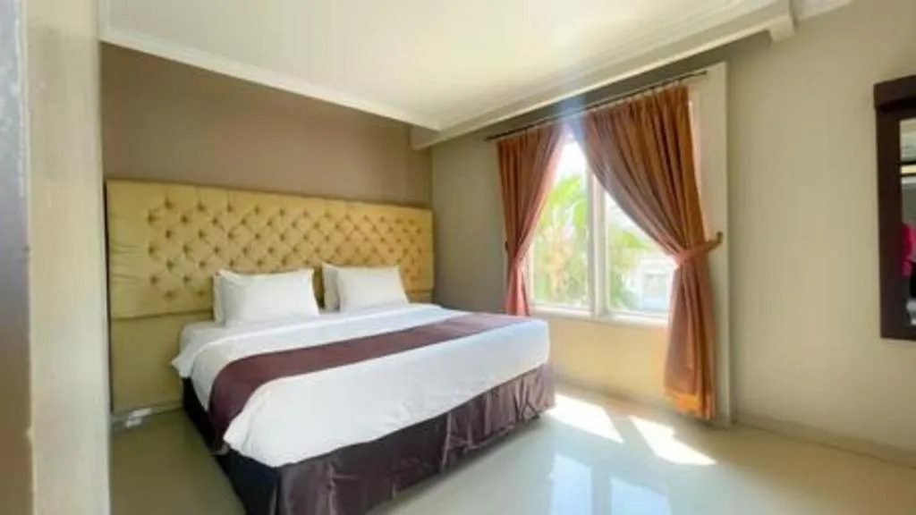 Bed in Rizen Premiere Hotel