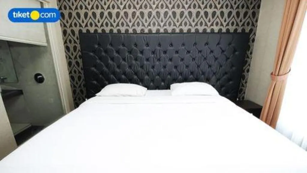 Bed in Rizen Premiere Hotel