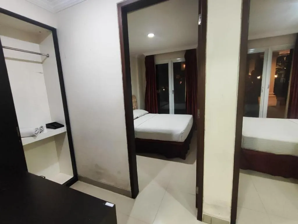 Bed in Rizen Premiere Hotel