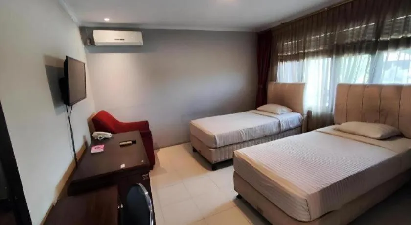 Bed in Rizen Premiere Hotel