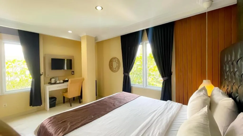 Bed in Rizen Premiere Hotel