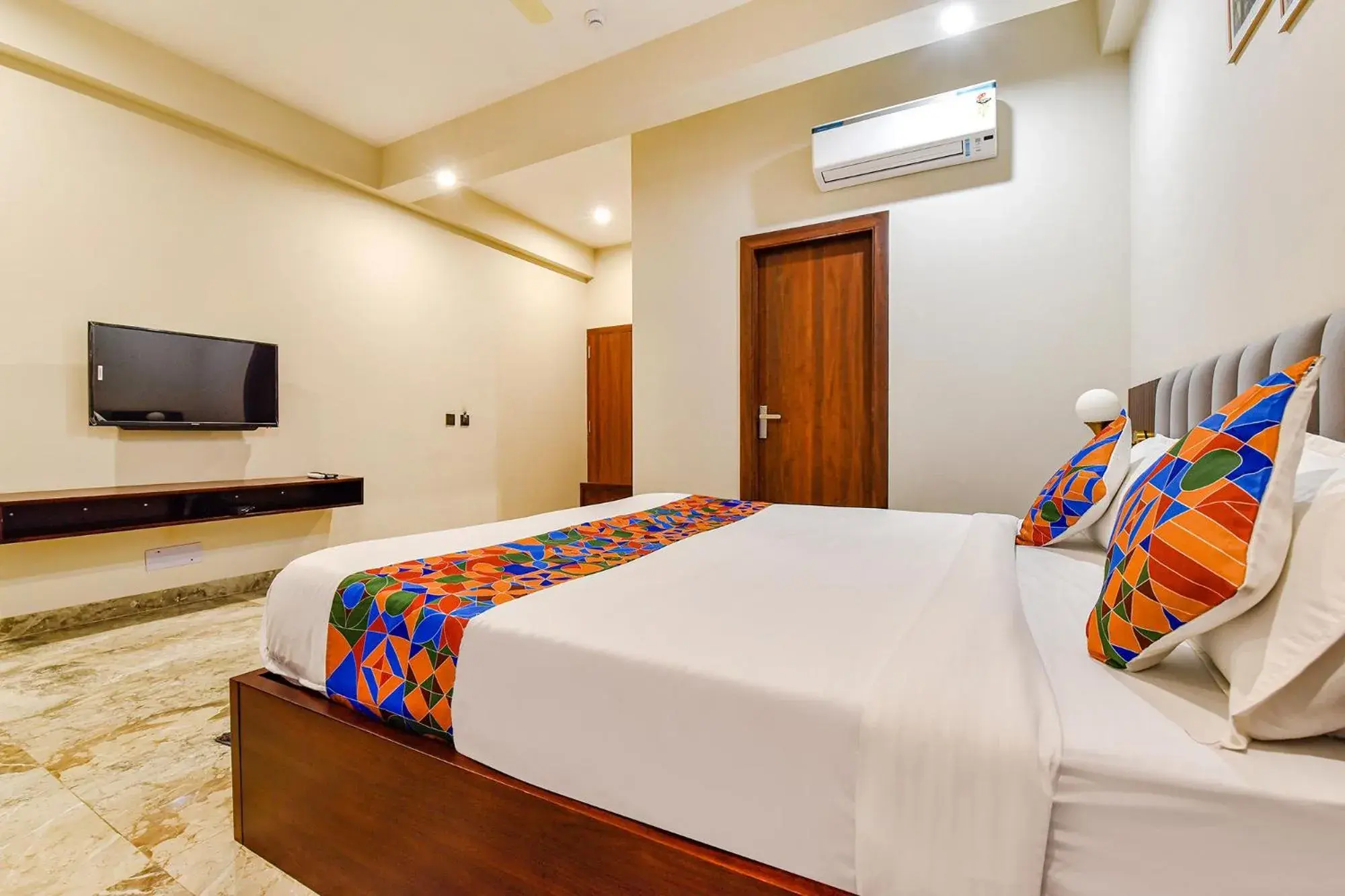 Bed in FabHotel Pravaasam Residency Bed in FabHotel Pravaasam Residency