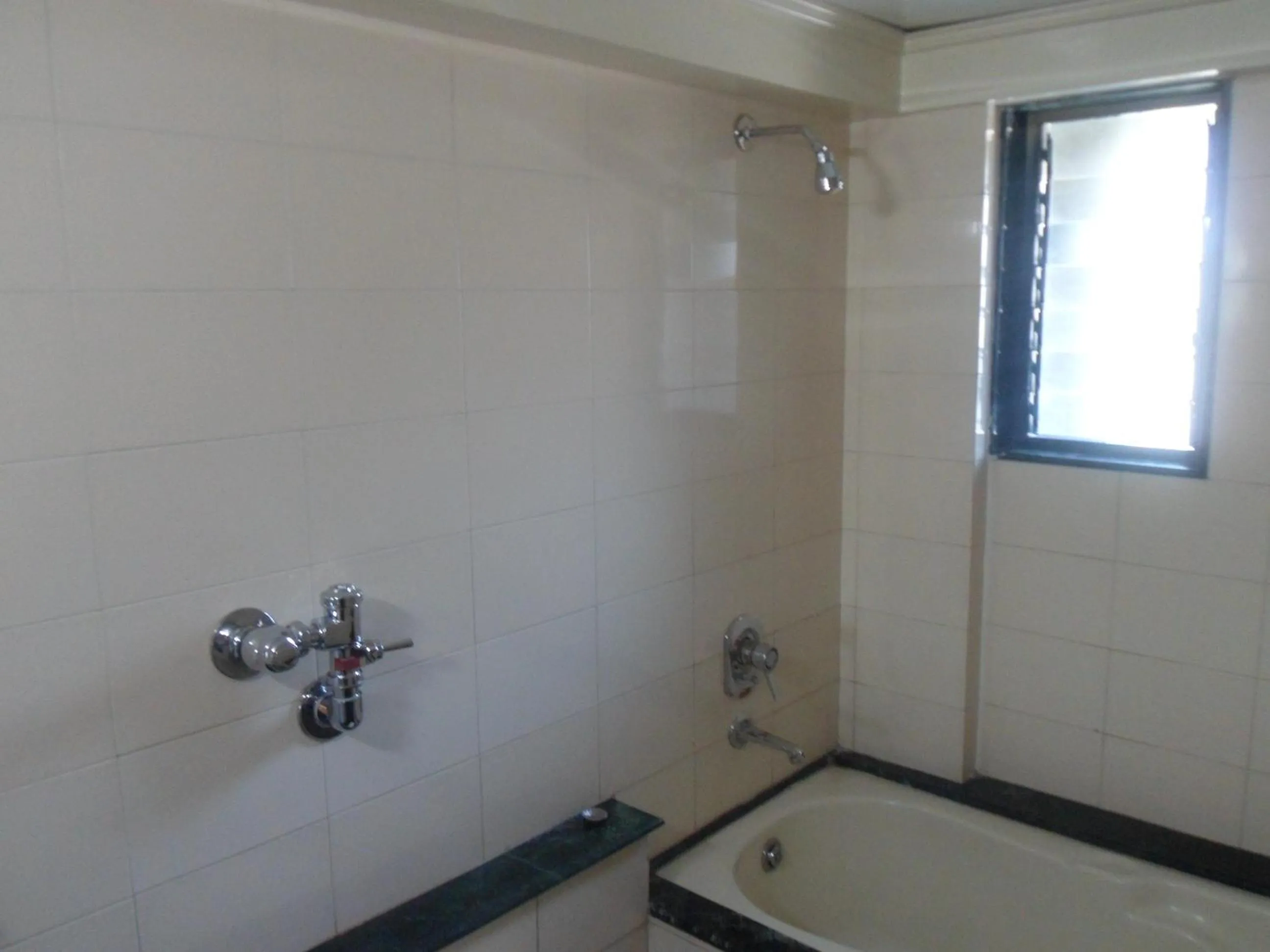 Bathroom in Hotel Pooja International