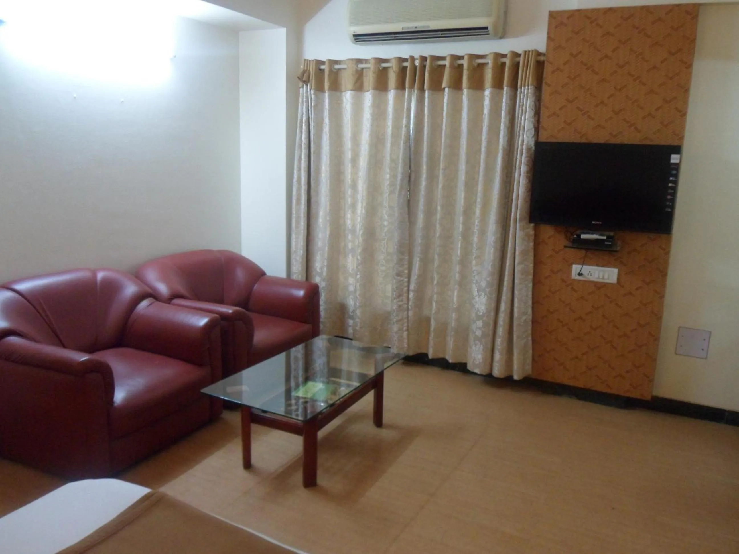 Seating area in Hotel Pooja International